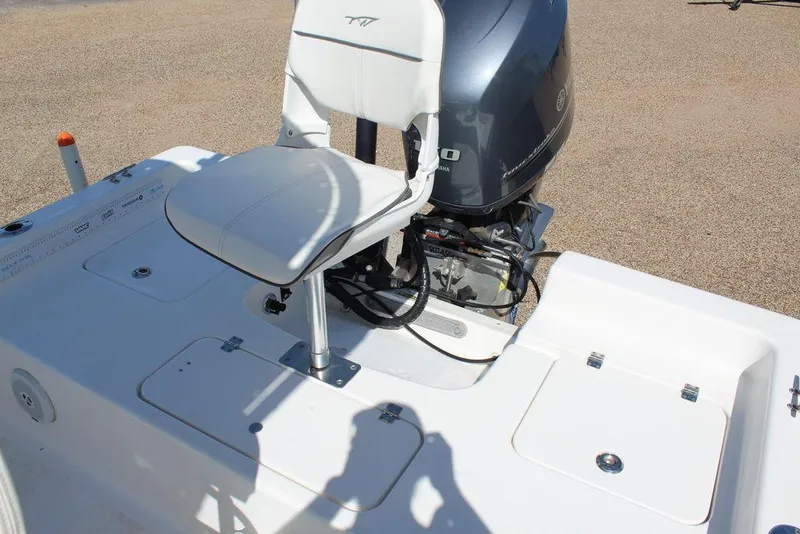 Slide: The Image of 2015 Tidewater Bay Max 2100 boat interior with seat and engine. - 10