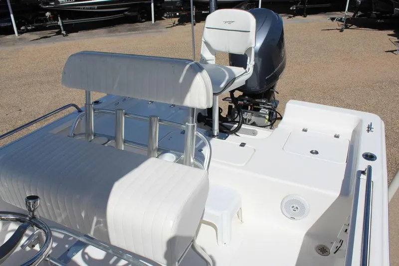 Slide: The Image of 2015 Tidewater Bay Max 2100 boat interior with seating and motor. - 5
