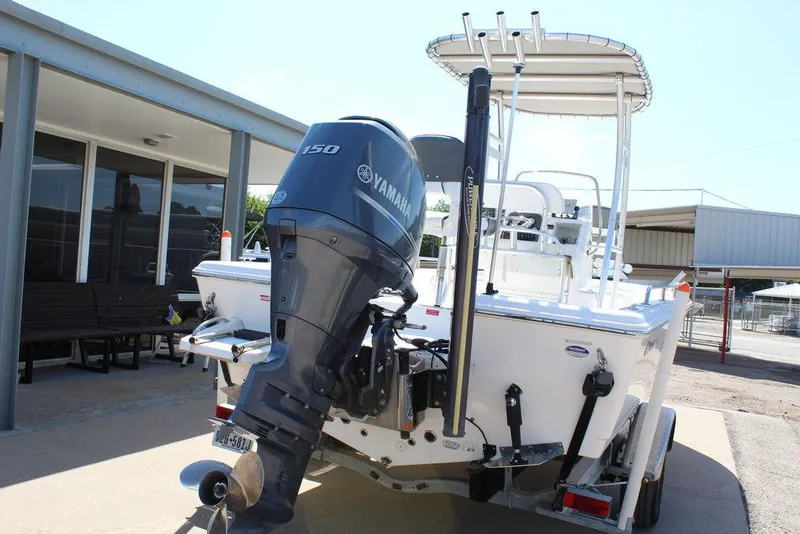 Slide: The Image of 2015 Tidewater Bay Max 2100 boat with Yamaha 150 outboard motor, parked outdoors. - 8