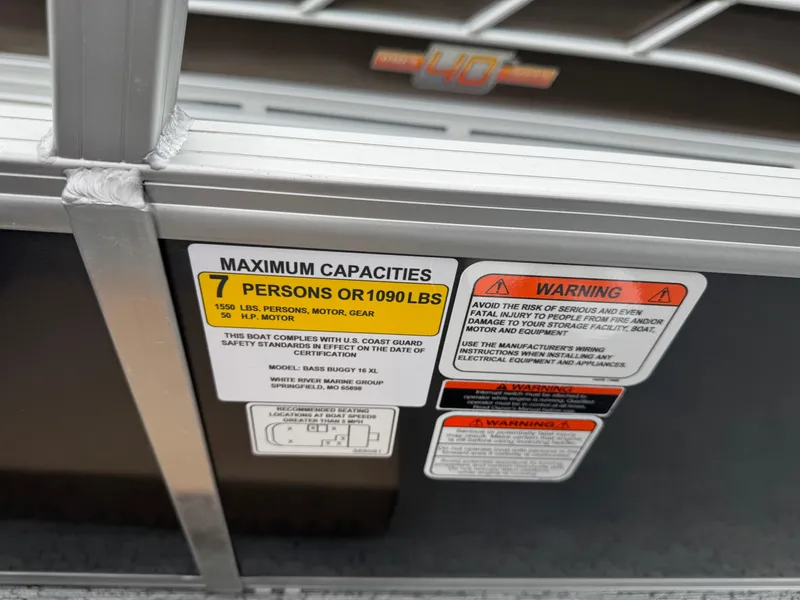 Slide: The Image of 2026 Sun Tracker Bass Buggy 16 XL capacity label, showing 7-person or 1090 lbs limit. - 15