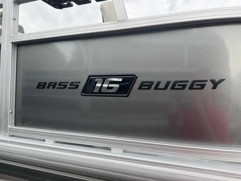 Slide: The Image of 2026 Sun Tracker Bass Buggy 16 XL logo on metallic surface. - 3