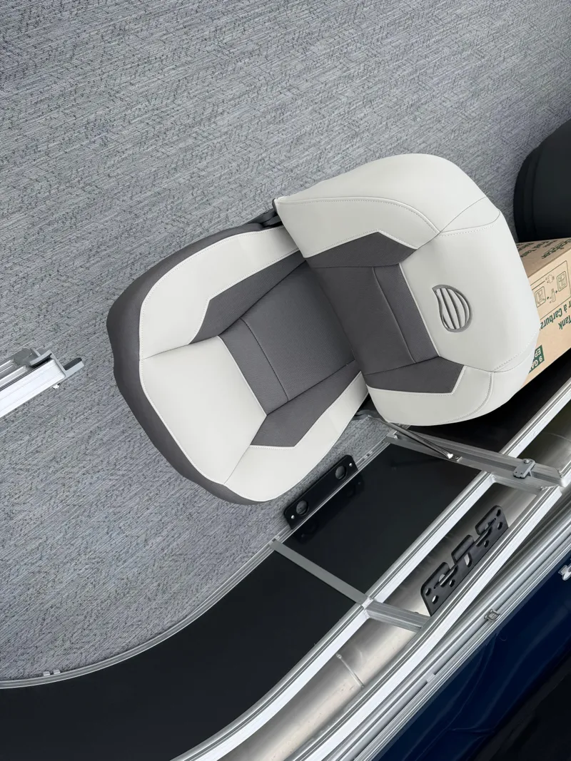 Slide: The Image of 2026 Sun Tracker Bass Buggy 16 XL boat seat, gray and white design, on deck. - 7