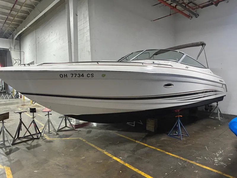 The Image of 2001 Formula 280 Sun Sport boat in indoor storage on stands. - 0