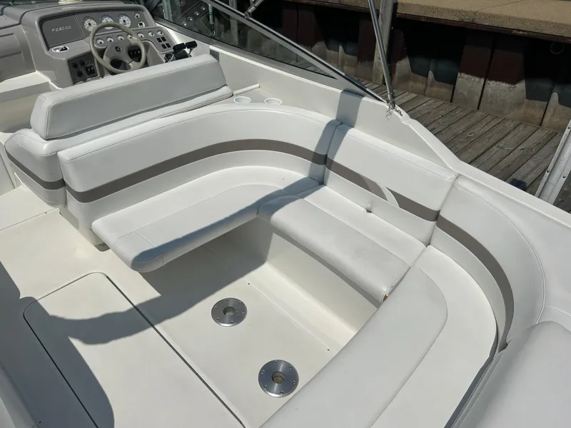 Slide: The Image of 2001 Formula 280 Sun Sport boat interior with white seating and control panel. - 11