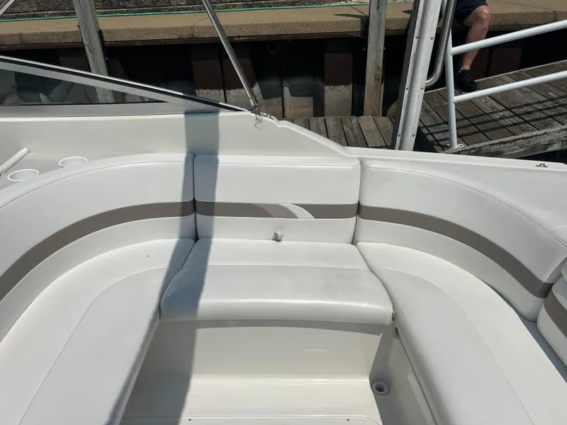 Slide: The Image of 2001 Formula 280 Sun Sport boat interior with white seating and cup holders. - 12