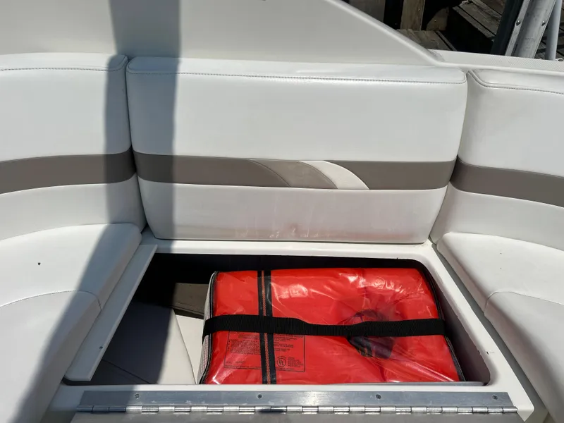 Slide: The Image of Storage compartment on 2001 Formula 280 Sun Sport boat with red safety equipment. - 13