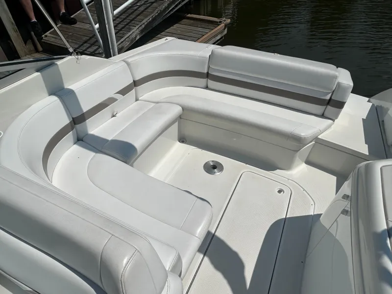 Slide: The Image of 2001 Formula 280 Sun Sport boat interior with white cushioned seating. - 14