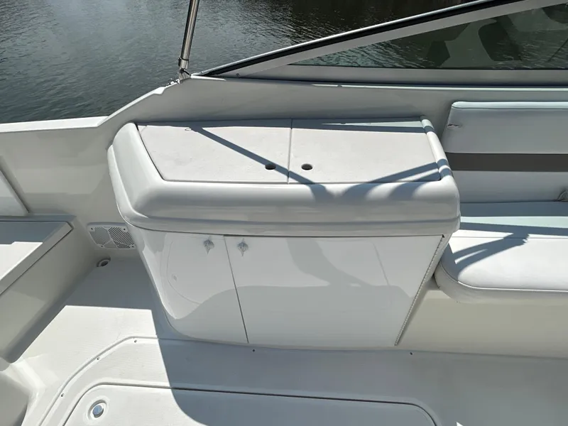Slide: The Image of 2001 Formula 280 Sun Sport boat interior with white seating and storage area. - 18