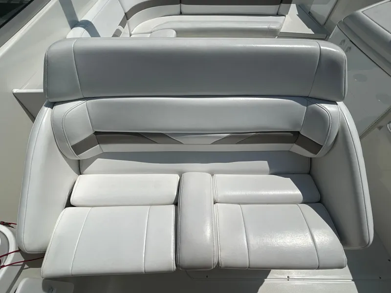 Slide: The Image of 2001 Formula 280 Sun Sport boat interior with white cushioned seating. - 25