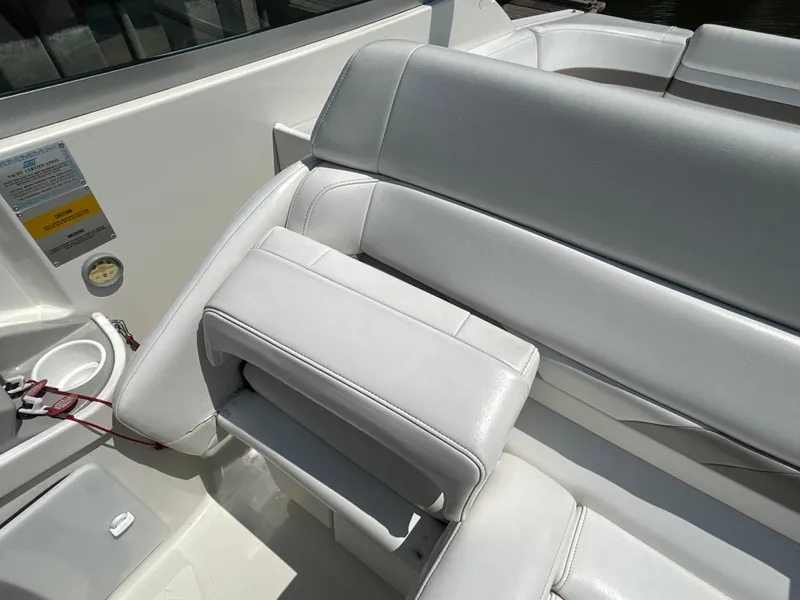 Slide: The Image of 2001 Formula 280 Sun Sport boat interior with white leather seating and cup holders. - 26