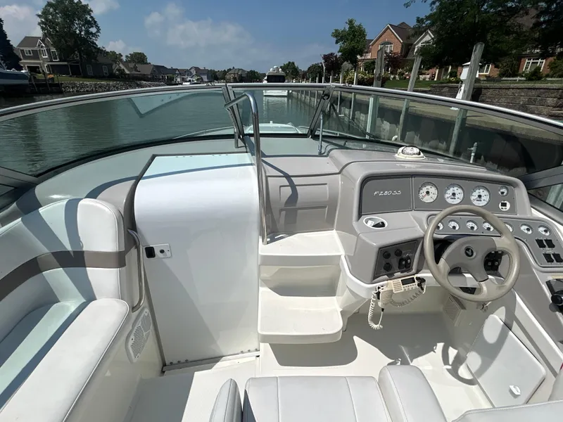 Slide: The Image of 2001 Formula 280 Sun Sport boat interior with steering wheel and dashboard controls. - 27