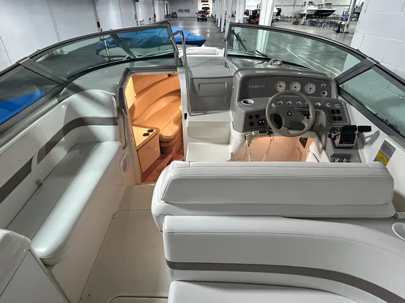 Slide: The Image of 2001 Formula 280 Sun Sport boat interior with helm, seating, and cabin view. - 37