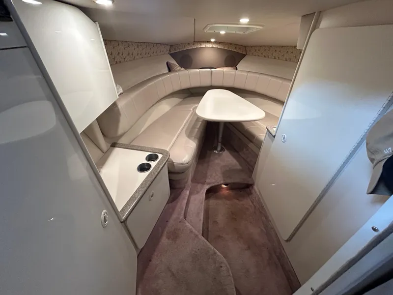 Slide: The Image of 2001 Formula 280 Sun Sport cabin interior with beige seating and table. - 38