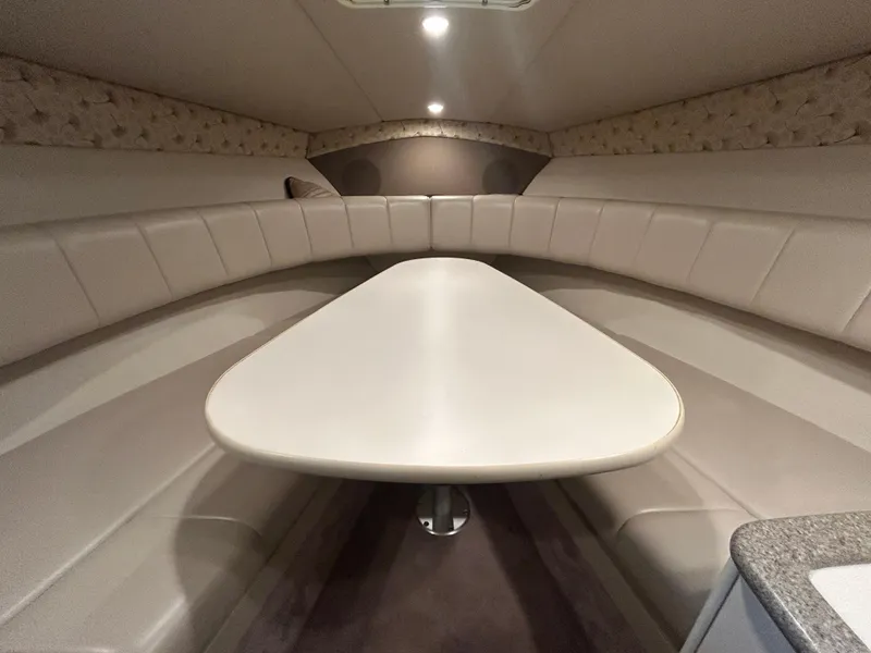 Slide: The Image of 2001 Formula 280 Sun Sport cabin interior with beige seating and table. - 39
