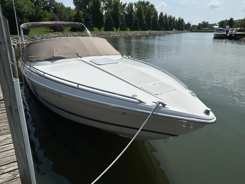 Slide: The Image of 2001 Formula 280 Sun Sport boat docked on a calm river. - 4