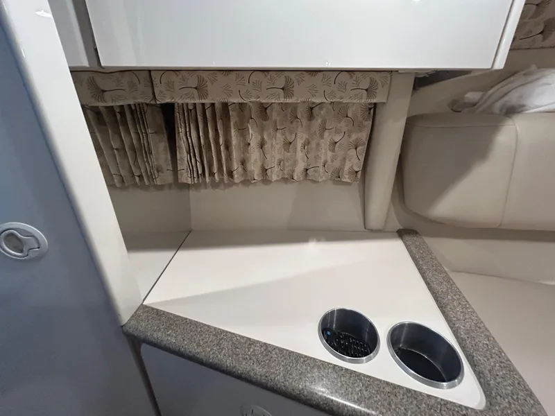 Slide: The Image of Interior of 2001 Formula 280 Sun Sport boat with cup holders and patterned curtains. - 42