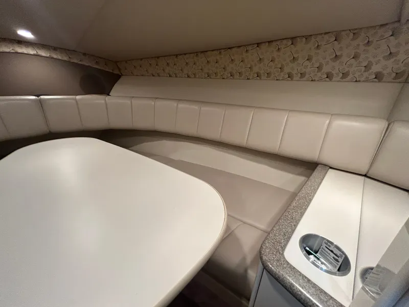 Slide: The Image of Interior of 2001 Formula 280 Sun Sport boat with beige seating and table. - 43