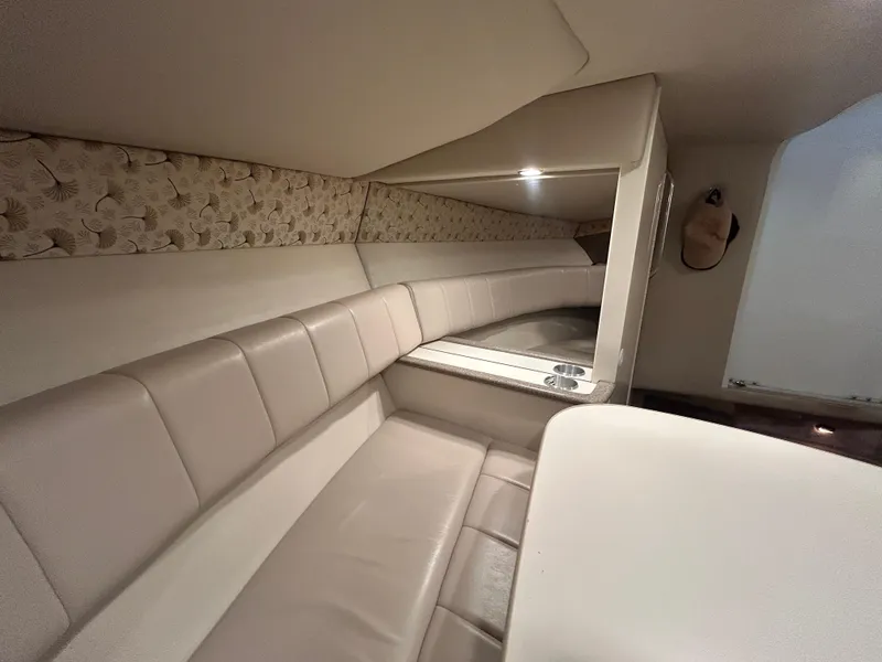 Slide: The Image of Interior of 2001 Formula 280 Sun Sport boat with beige seating and floral accents. - 44