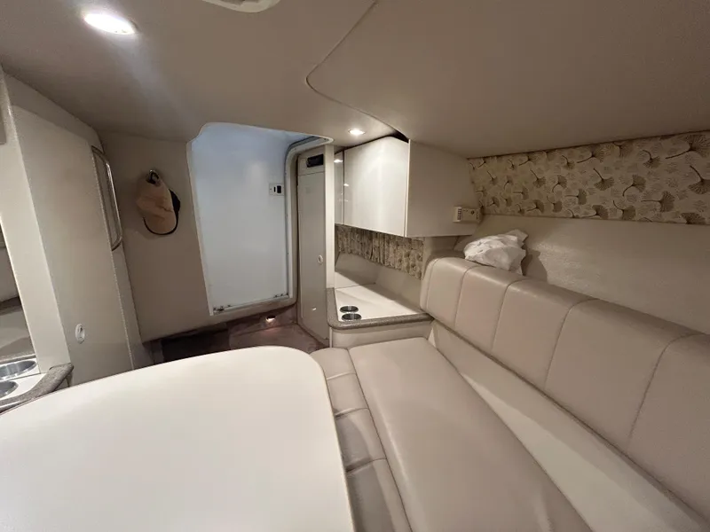 Slide: The Image of Interior of 2001 Formula 280 Sun Sport boat, featuring beige seating and modern design. - 46