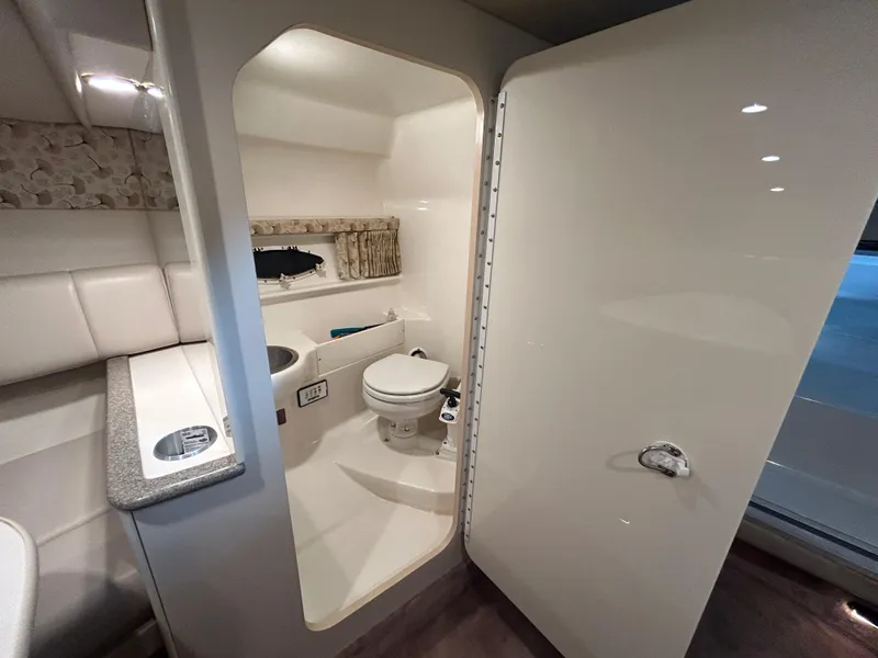 Slide: The Image of Interior of a 2001 Formula 280 Sun Sport boat featuring a compact bathroom. - 47