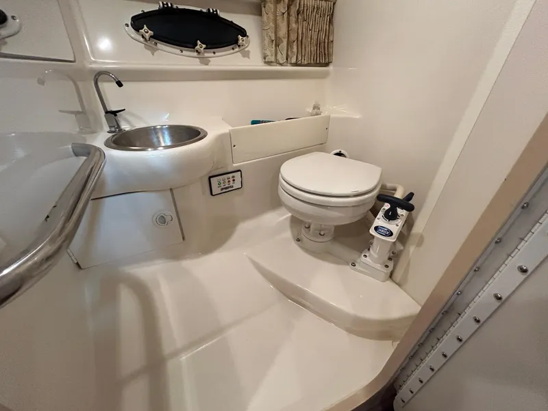 Slide: The Image of 2001 Formula 280 Sun Sport boat bathroom with sink and toilet. - 49