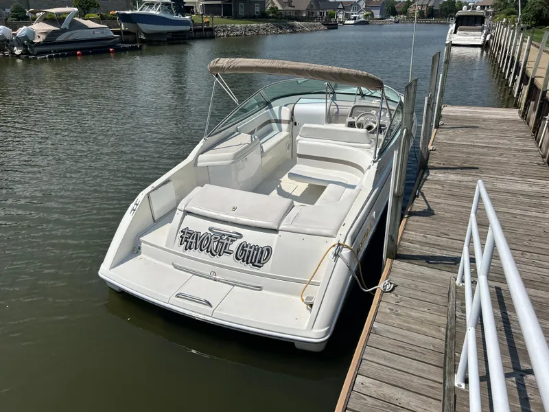 Slide: The Image of 2001 Formula 280 Sun Sport boat docked at marina, featuring "Favorite Child" on the stern. - 8