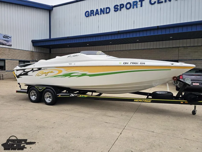 Slide: The Image of 2005 Baja 23 Outlaw boat on trailer outside Grand Sport Center. - 14