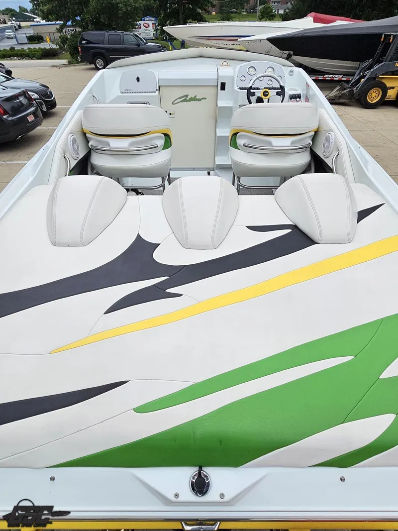 Slide: The Image of 2005 Baja 23 Outlaw boat interior with vibrant upholstery design. - 44