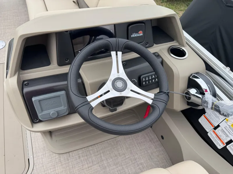 Slide: The Image of 2025 Sun Tracker SportFish 22 XP3 steering console with modern controls and sleek design. - 12