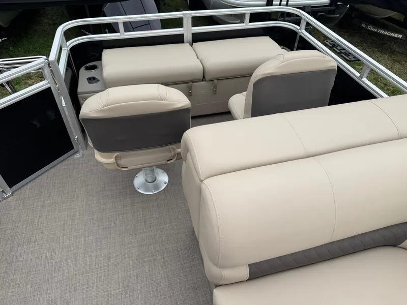 Slide: The Image of 2025 Sun Tracker SportFish 22 XP3 boat interior with beige seating and modern design. - 16