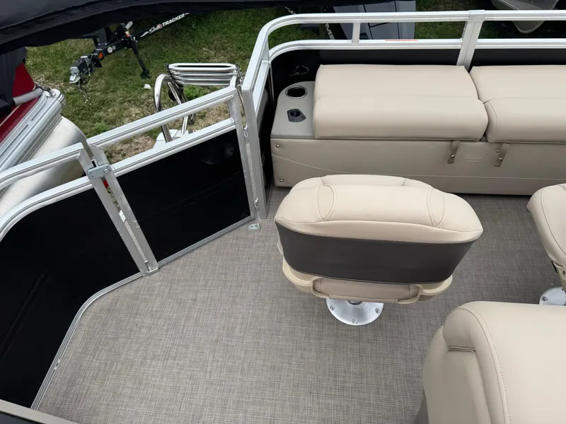 Slide: The Image of 2025 Sun Tracker SportFish 22 XP3 interior with beige seating and carpeted flooring. - 17