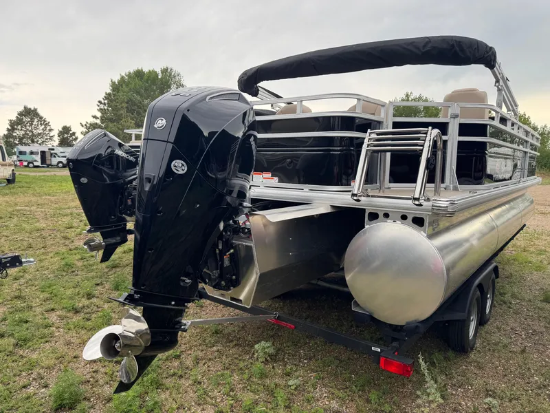 Slide: The Image of 2025 Sun Tracker SportFish 22 XP3 pontoon boat with dual Mercury outboard motors. - 4
