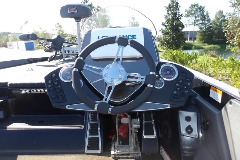 Slide: The Image of 2017 Ranger Z518c boat dashboard with steering wheel and control panel. - 1