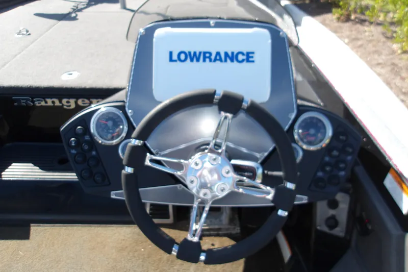 Slide: The Image of 2017 Ranger Z518c boat dashboard with Lowrance display and steering wheel. - 7