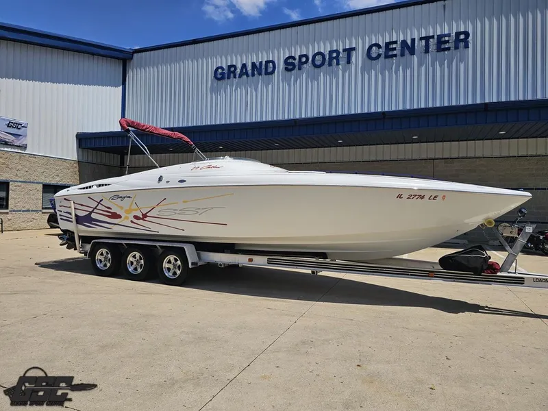 Slide: The Image of 2000 Baja 29 Outlaw boat on trailer at Grand Sport Center. - 16