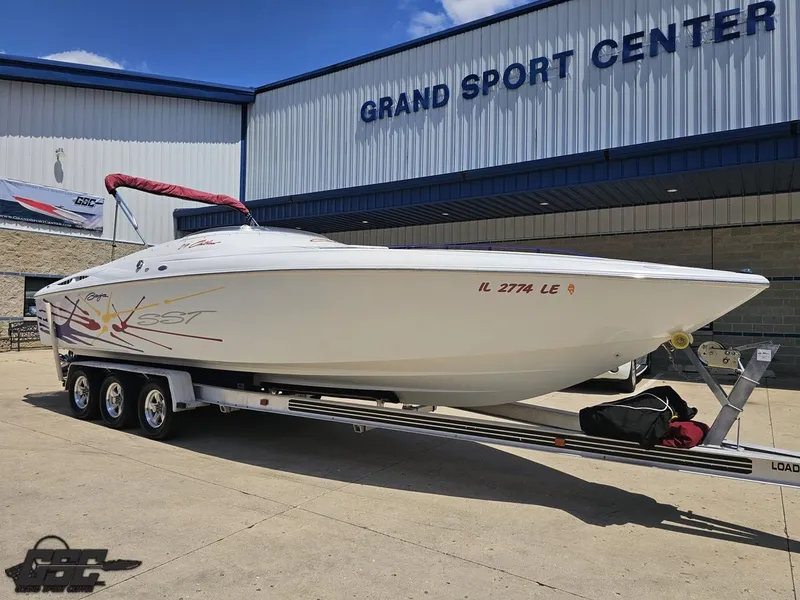 Slide: The Image of 2000 Baja 29 Outlaw boat on trailer at Grand Sport Center. - 17