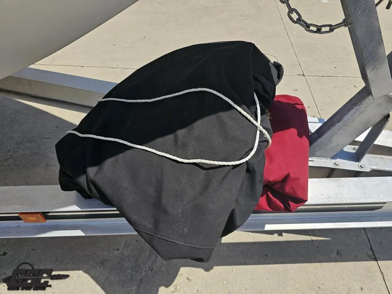 Slide: The Image of Black and red covers on a trailer for a 2000 Baja 29 Outlaw boat. - 19