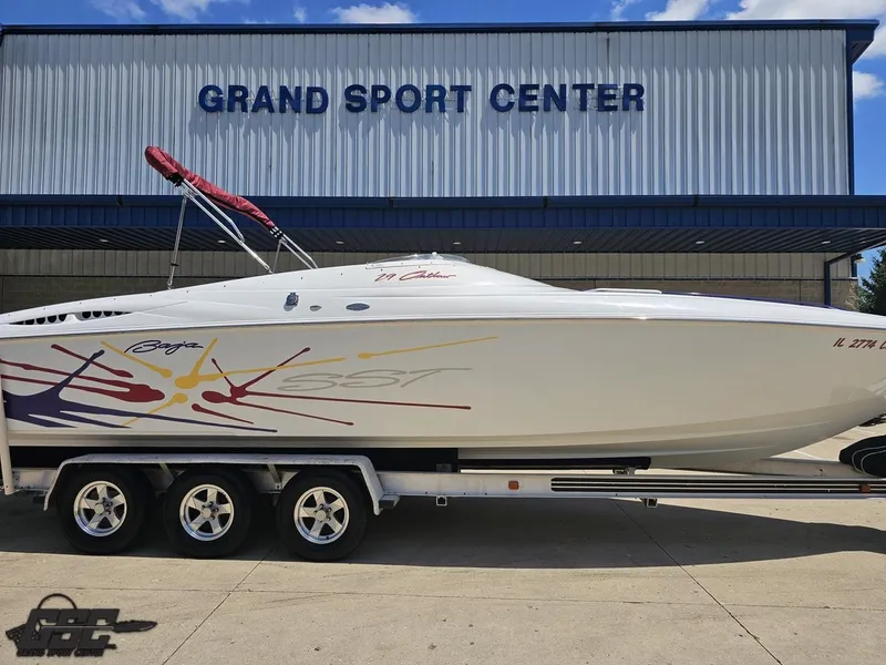 Slide: The Image of 2000 Baja 29 Outlaw boat on trailer at Grand Sport Center. - 4