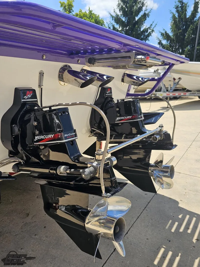 Slide: The Image of 2000 Baja 29 Outlaw boat with dual Mercury MerCruiser engines and stainless steel propellers. - 42