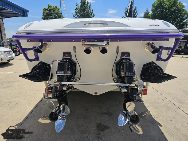 Slide: The Image of Rear view of a 2000 Baja 29 Outlaw boat with dual propellers. - 43