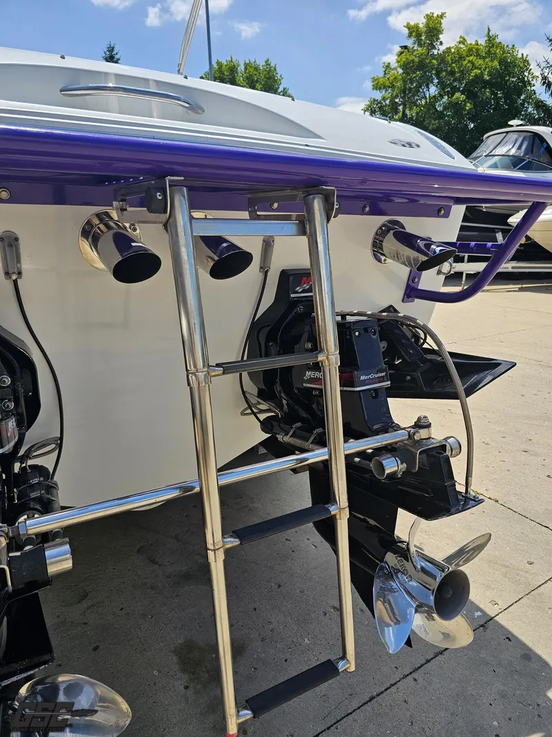 Slide: The Image of Rear view of 2000 Baja 29 Outlaw boat with ladder and dual propellers. - 47