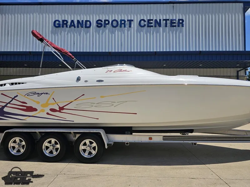 Slide: The Image of 2000 Baja 29 Outlaw boat on trailer at Grand Sport Center. - 5