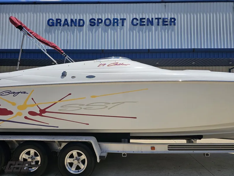 Slide: The Image of 2000 Baja 29 Outlaw boat on trailer at Grand Sport Center. - 6