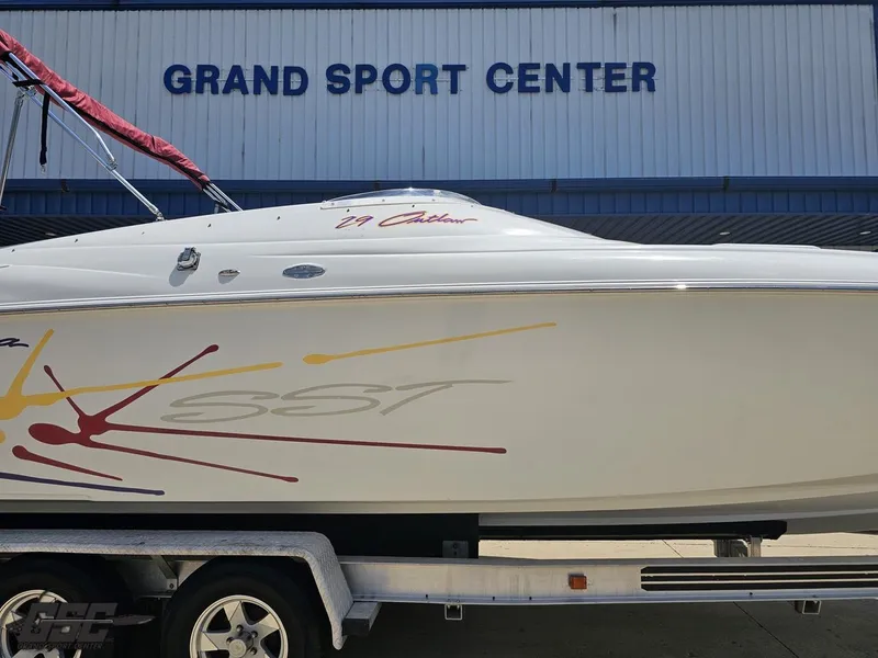 Slide: The Image of 2000 Baja 29 Outlaw boat on trailer at Grand Sport Center. - 7