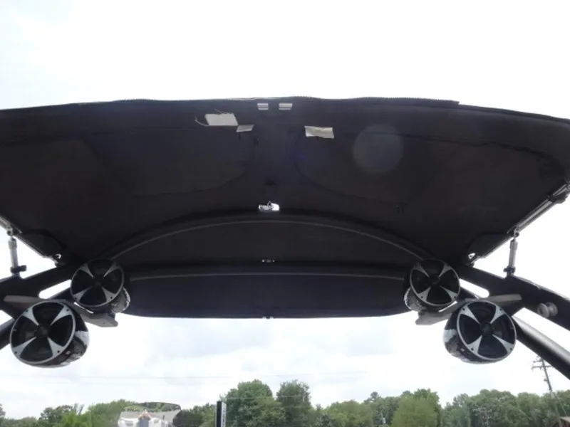 Slide: The Image of 2018 Malibu 23 LSV boat with speakers mounted under the canopy. - 16