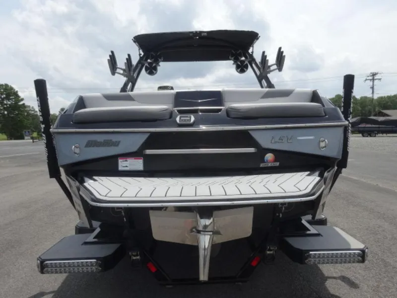 Slide: The Image of Rear view of a 2018 Malibu 23 LSV boat with sleek design and swim platform. - 3