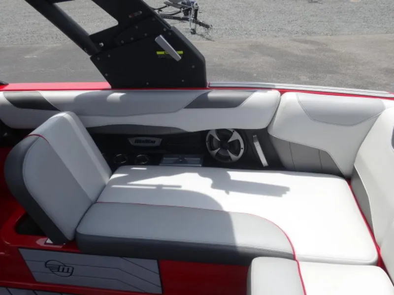 Slide: The Image of 2018 Malibu 23 LSV boat interior with red and white seating. - 5