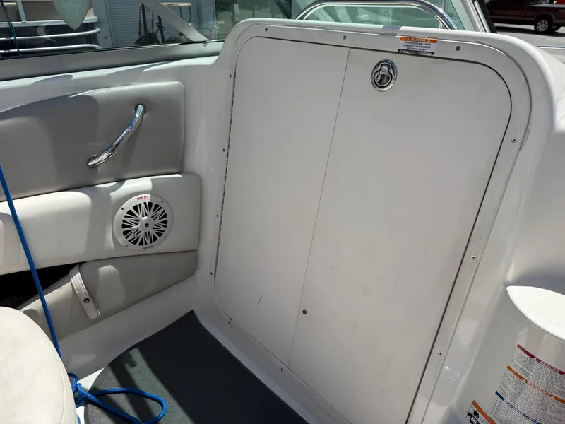 Slide: The Image of 2007 Chaparral 215 SSi boat interior with speaker and storage compartment. - 16