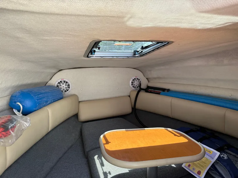 Slide: The Image of Interior cabin of 2007 Chaparral 215 SSi boat with seating and table. - 19