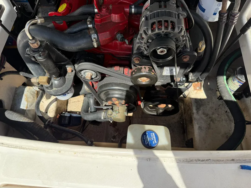 Slide: The Image of Engine compartment of a 2007 Chaparral 215 SSi boat, showing belts and components. - 24